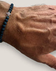 Pulsera con tortuguita plateada y lava azul añil