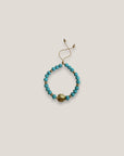 Pulsera con gran tortuga dorada lava azul turquesa