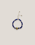 Armband mit einer großen goldenen Schildkröte und blauer Lava