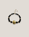 Armband mit großer goldener Schildkröte und schwarzer Lava