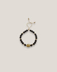 Pulsera con gran tortuga dorada lava marrón oscuro