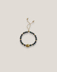 Pulsera con gran tortuga dorada perlas grises tornasoladas