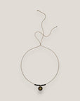 Collar midi medalla sol dorada esmalte negro lava negra separadores dorados cristalitos negros