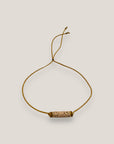Pulsera minimal con tubo de lava arena y cuentas doradas con brillis ámbar