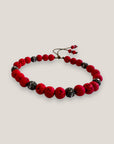 Pulsera Dafne con lava roja y filigranas bronce con cristalitoso
