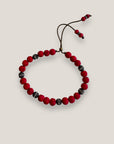 Pulsera Dafne con lava roja y filigranas bronce con cristalitoso