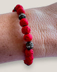 Pulsera Dafne con lava roja y filigranas bronce con cristalitoso
