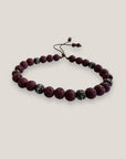 Pulsera Dafne con lava granate y filigrana bronce con cristalitos