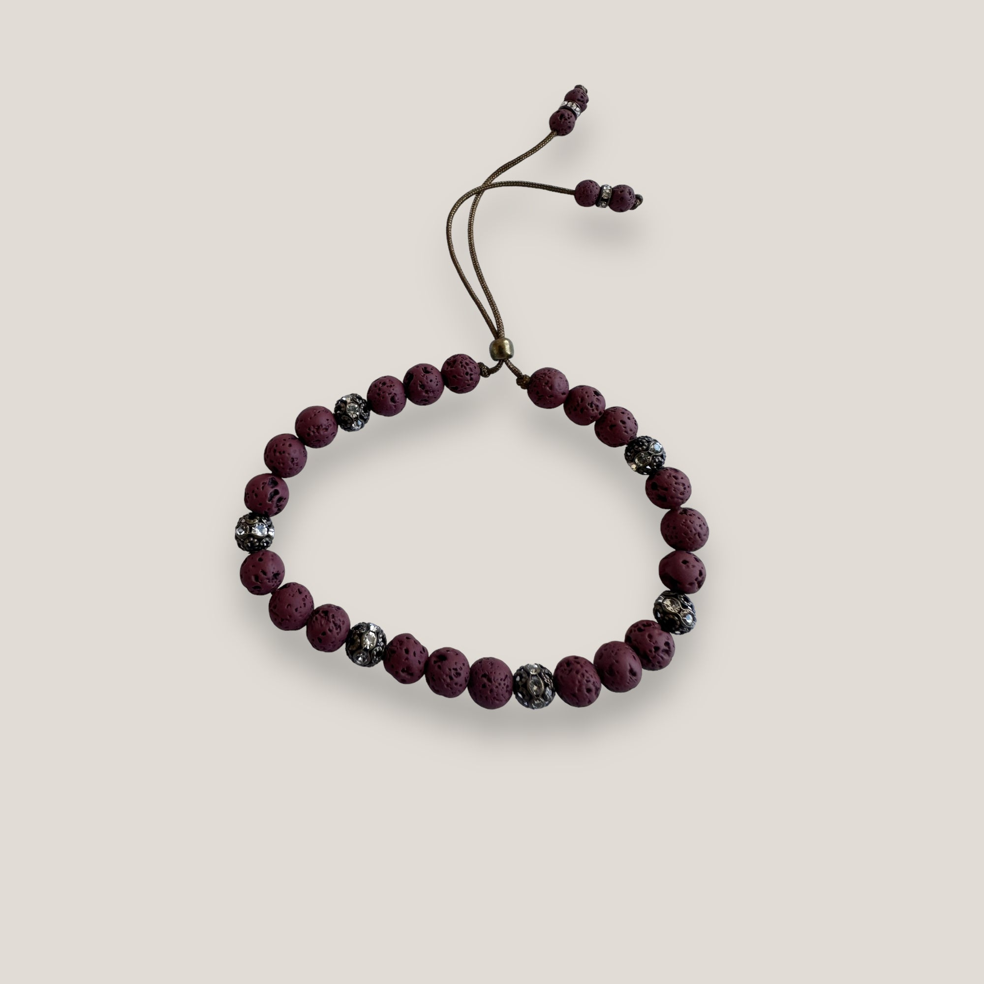 Pulsera Dafne con lava granate y filigrana bronce con cristalitos