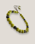 Pulsera Dafne con lava verde claro y filigrana bronce con cristalitos