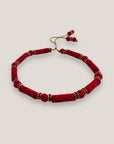Pulsera con tubos y cuentas de lava roja y brillis oro con cristalitos rojos