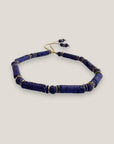 Pulsera con tubos y cuentas de lava azul profundoy brillis oro con cristalitos azules