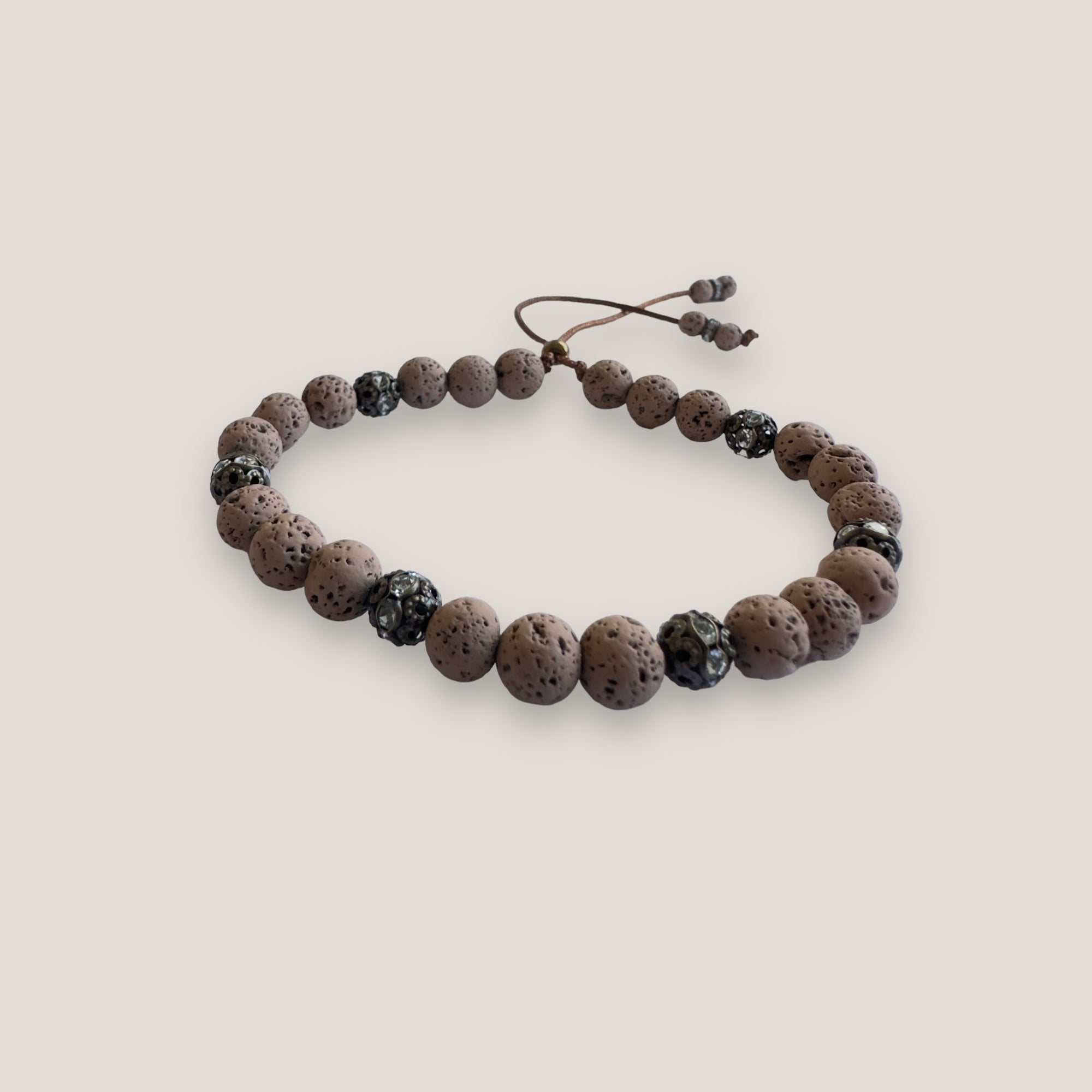 Pulsera Dafne con lava marrón claro y filigrana bronce con cristalitos