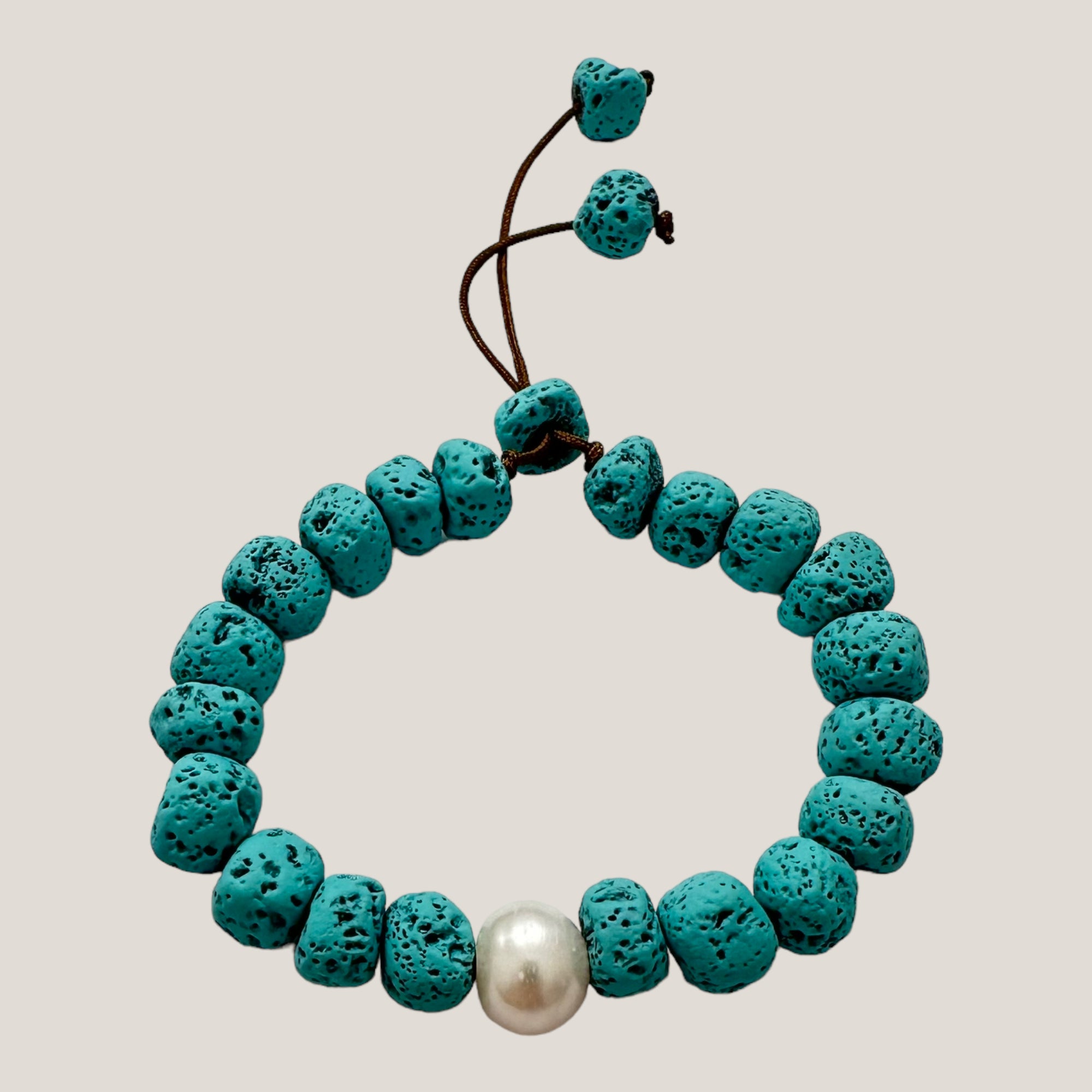 Bracelet with large golden turtle and colored lava