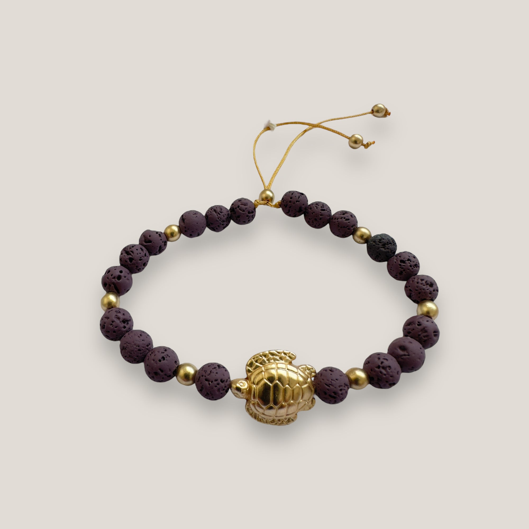 Bracelet with large golden turtle and colored lava