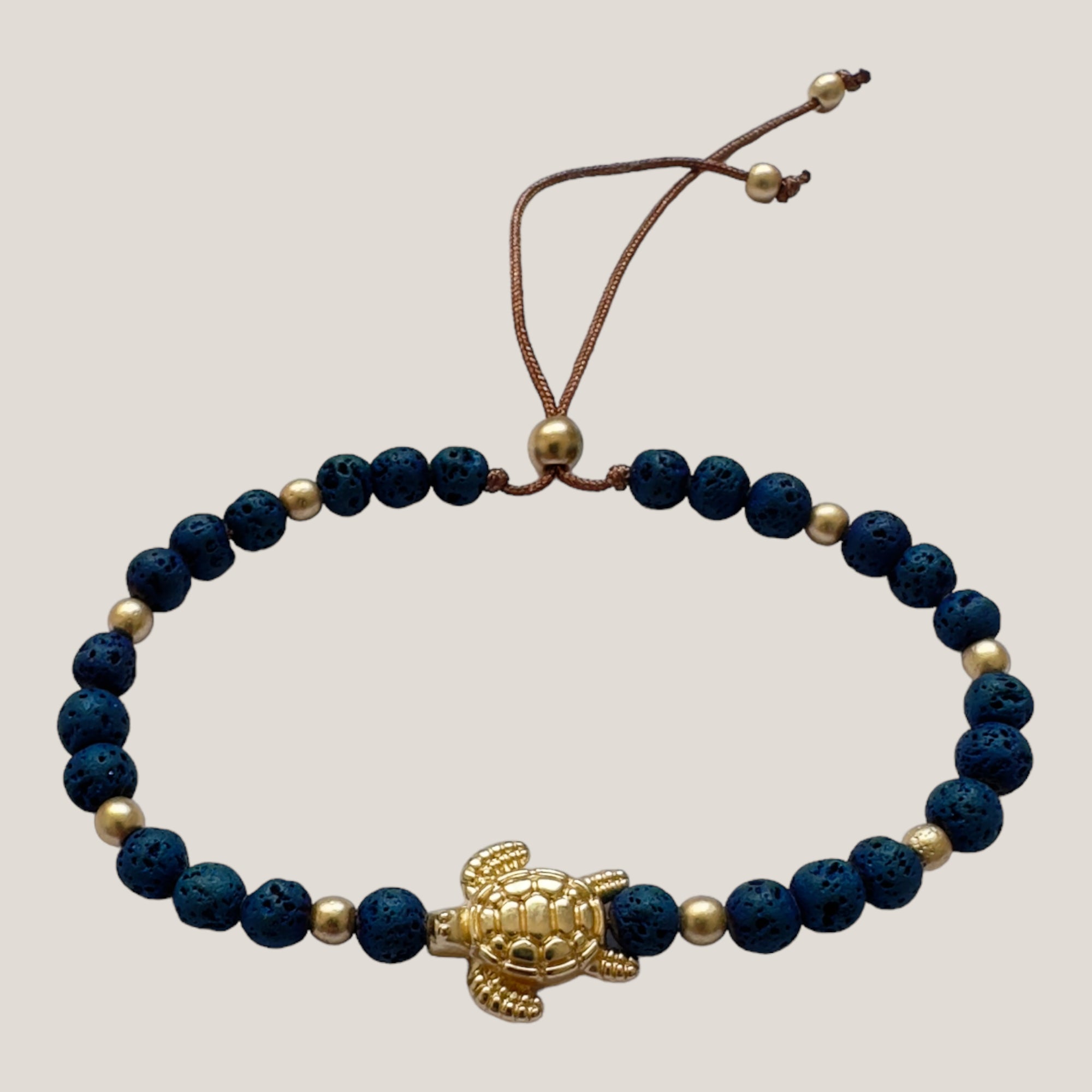 Bracelet with large golden turtle and colored lava