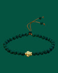 Pulsera con tortuguita dorada y lava verde oscuro