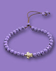 Pulsera con tortuguita dorada y lava malva
