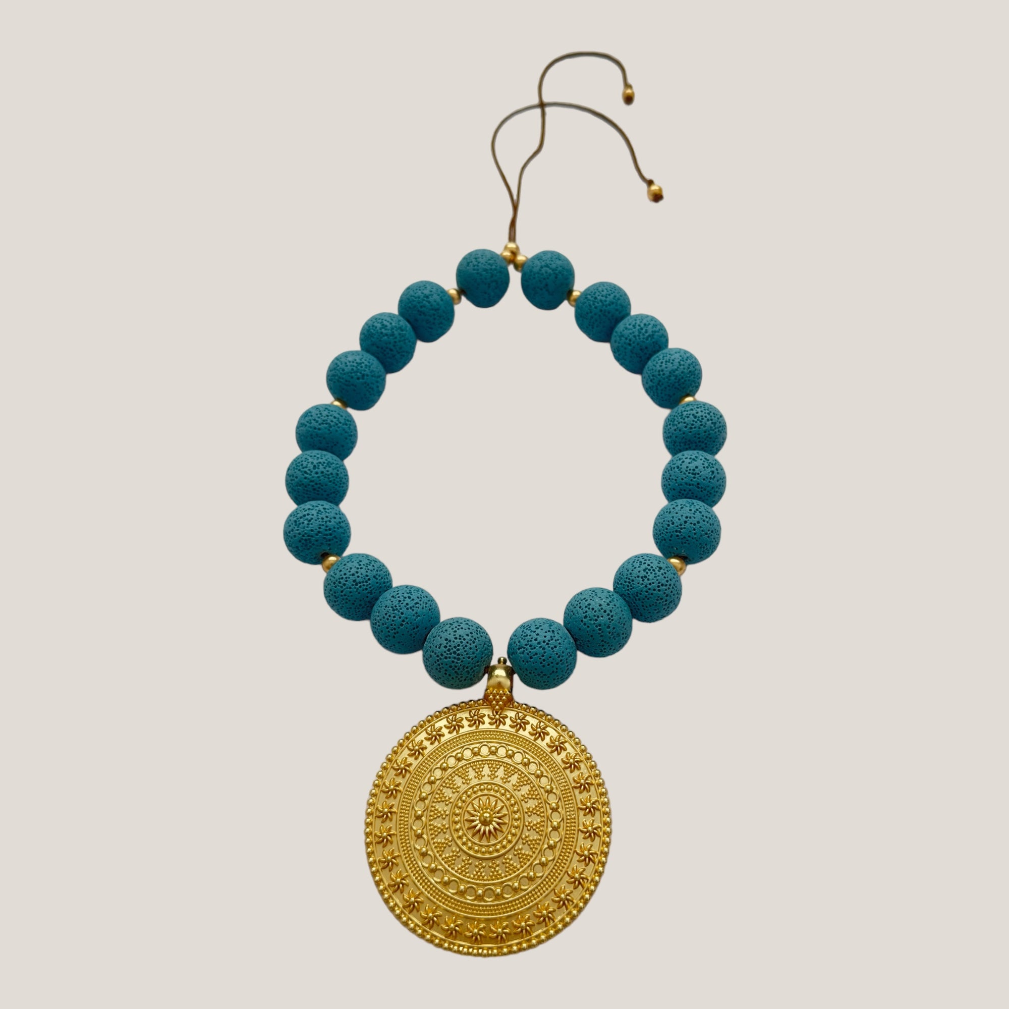 Maxi bracelet with golden turtle and colored lava