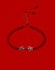 Pulsera con tortuguitas amor plateadas y lava roja