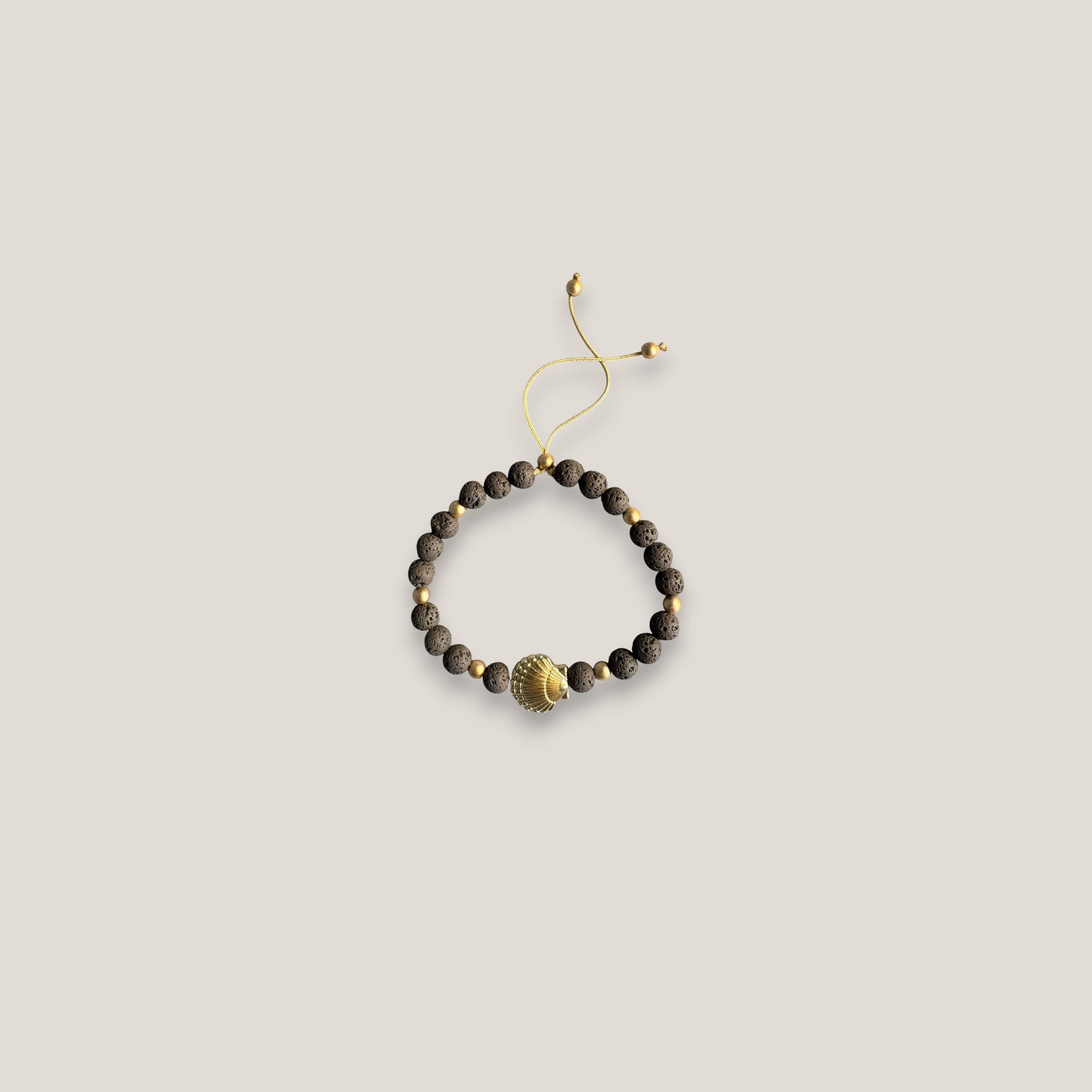 Pulsera gran concha dorada lava marrón oscuro