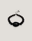 Pulsera cowrie negra mate lava negra