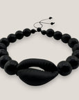 Pulsera cowrie negra mate ónix facetado pulido