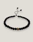 Pulsera con bola acero oro y lava negra