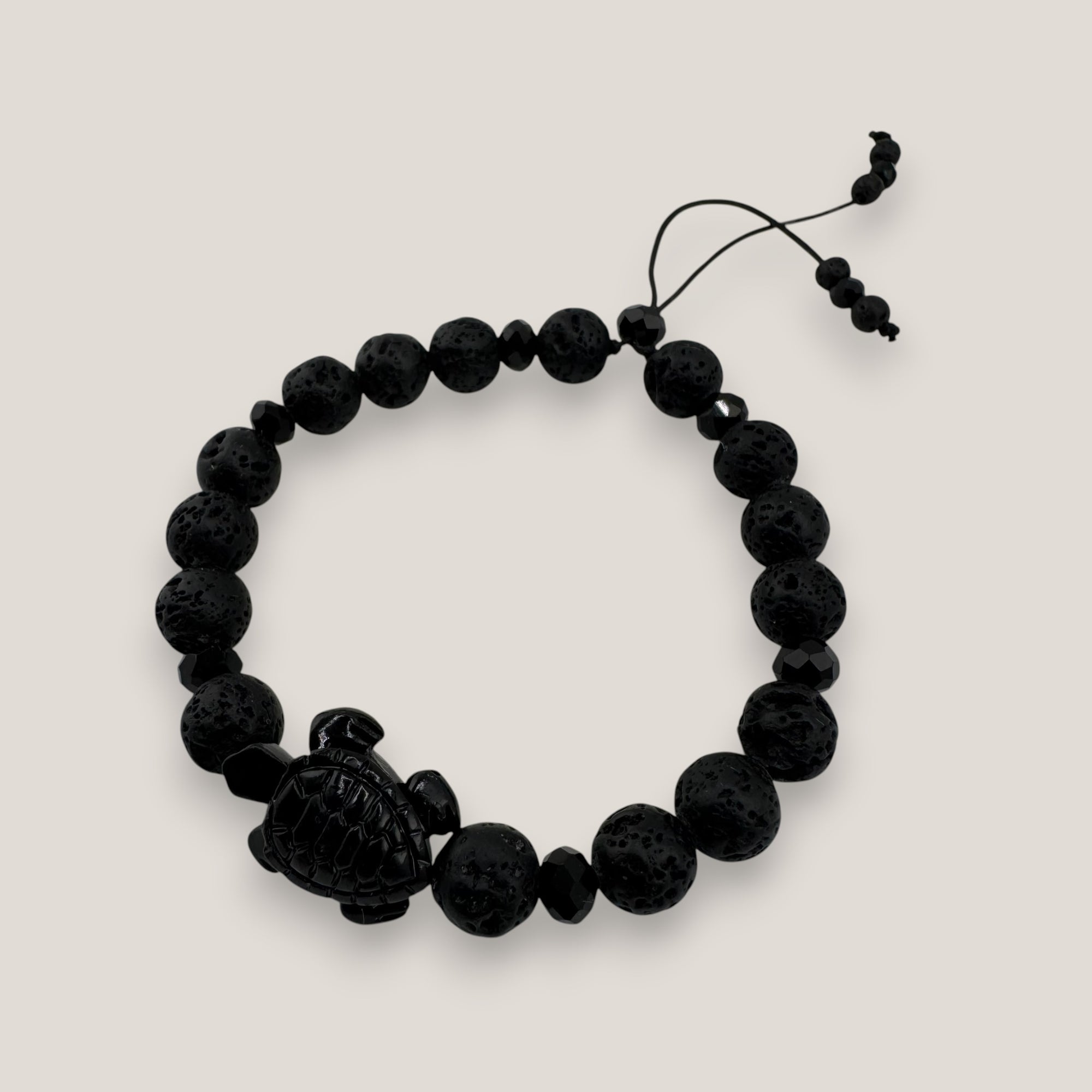 Pulsera tortuga resina negra lava negra cristales facetados negros