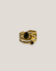 Goldring mit zwei facettierten schwarzen Kristallen, Stahlgold.