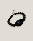 Pulsera cowrie negra mate lava negra