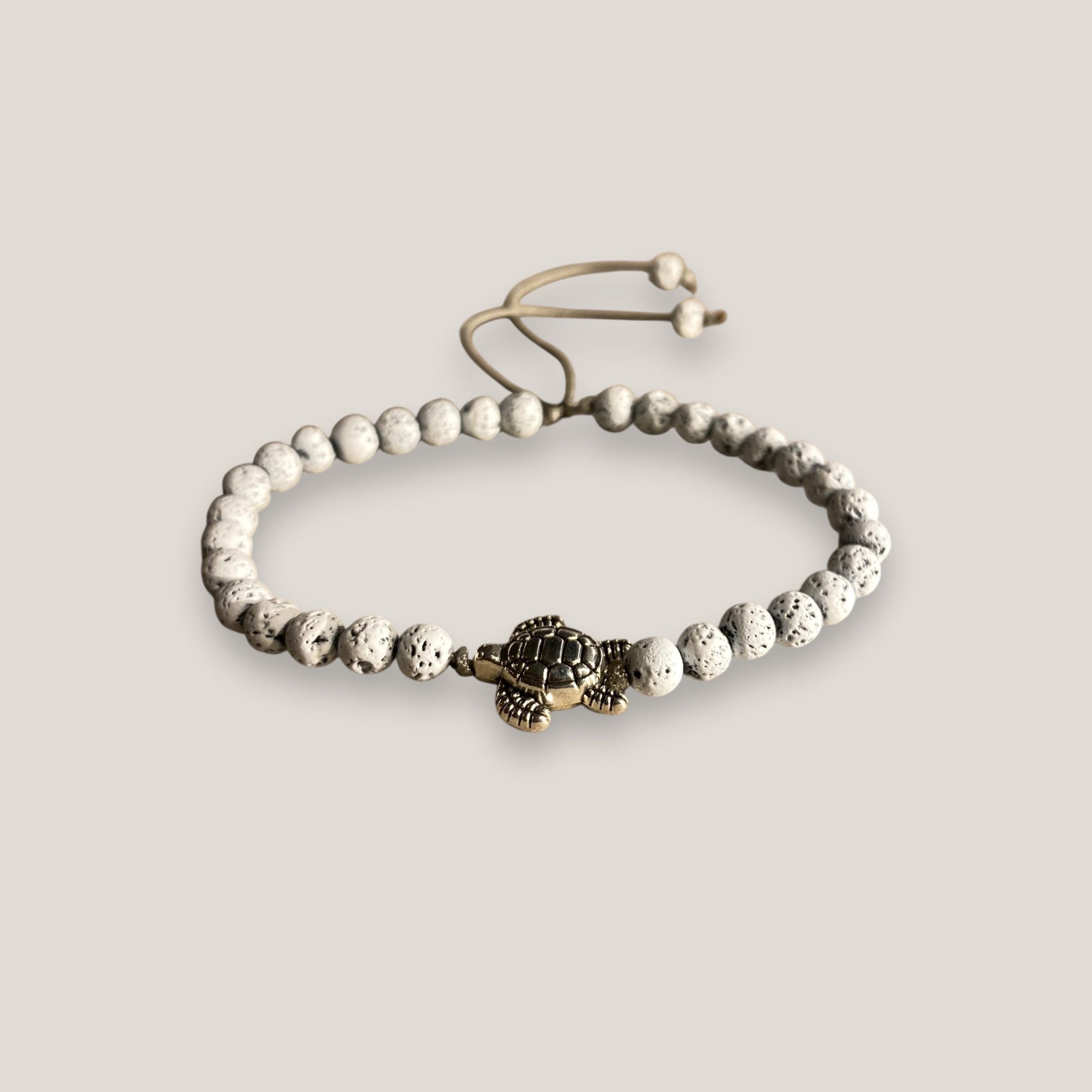 Pulsera tortuga plateada con lava blanca