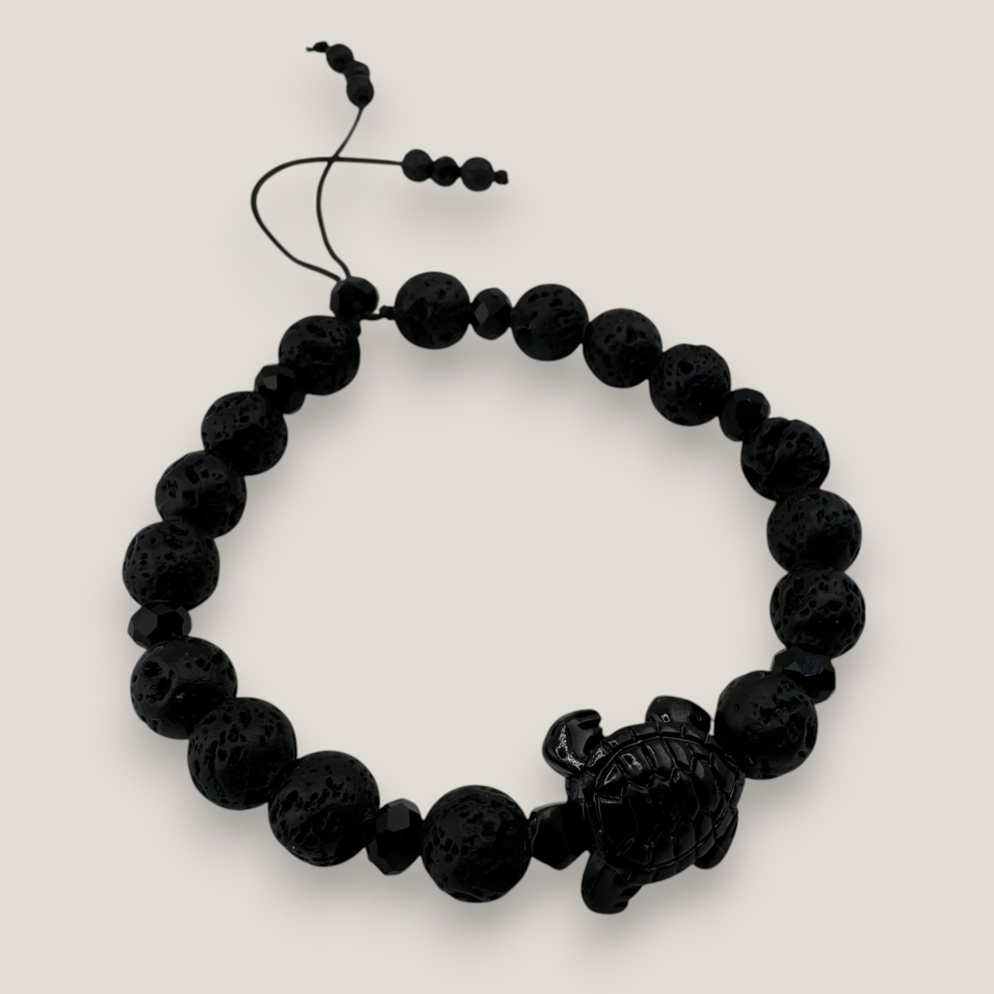 Pulsera tortuga resina negra lava negra cristales facetados negros