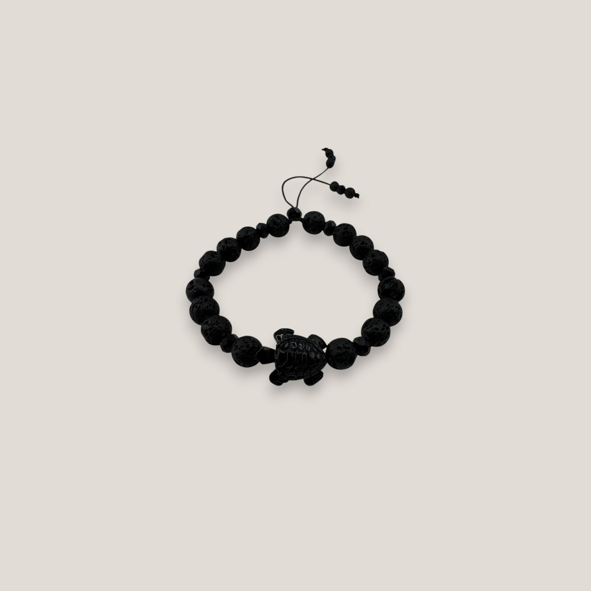 Pulsera tortuga resina negra lava negra cristales facetados negros