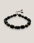 Pulsera Fuerte Beads Dafne, discos, tambores de lava negra, cuentas filigrana bronce con circonitas y separadores aro de acero oro