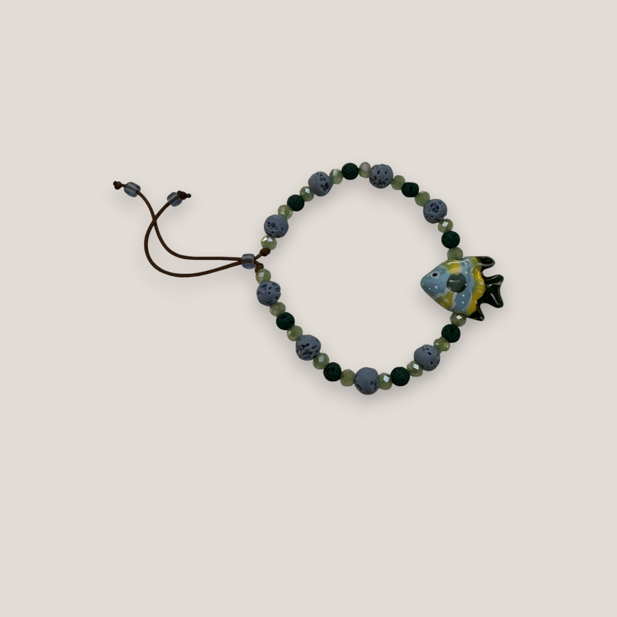 Pulsera pez verde azul amarillo esponja coral azul claro lava verde oscuro y cristales facetados verde claro