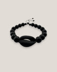 Pulsera cowrie negra mate ónix facetado pulido