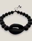 Pulsera cowrie negra mate lava negra