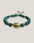 Pulsera con gran tortuga dorada lava azul turquesa