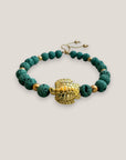 Armband mit einer großen goldenen Schildkröte und aquagrüner Lava