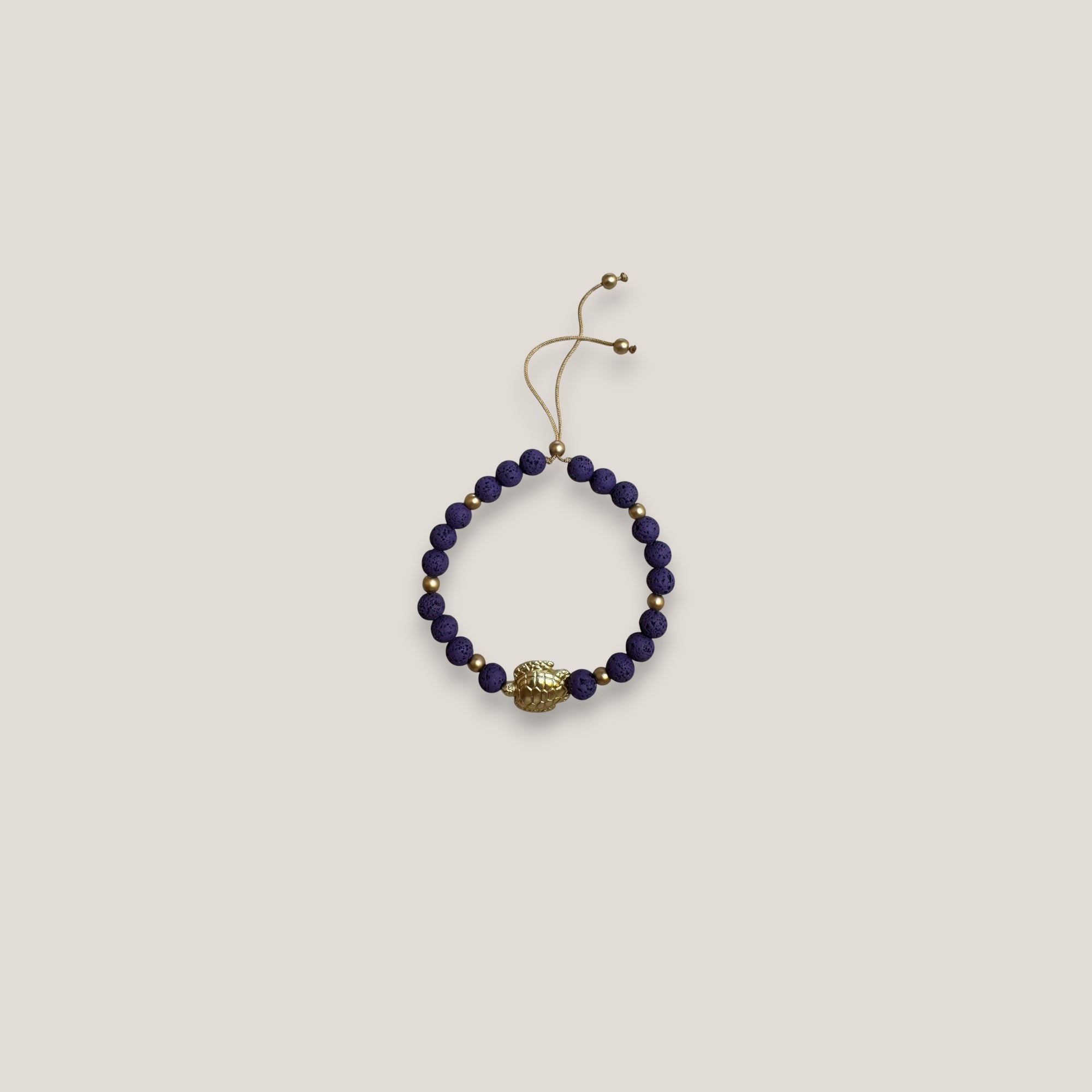 Bracelet with large golden turtle and colored lava