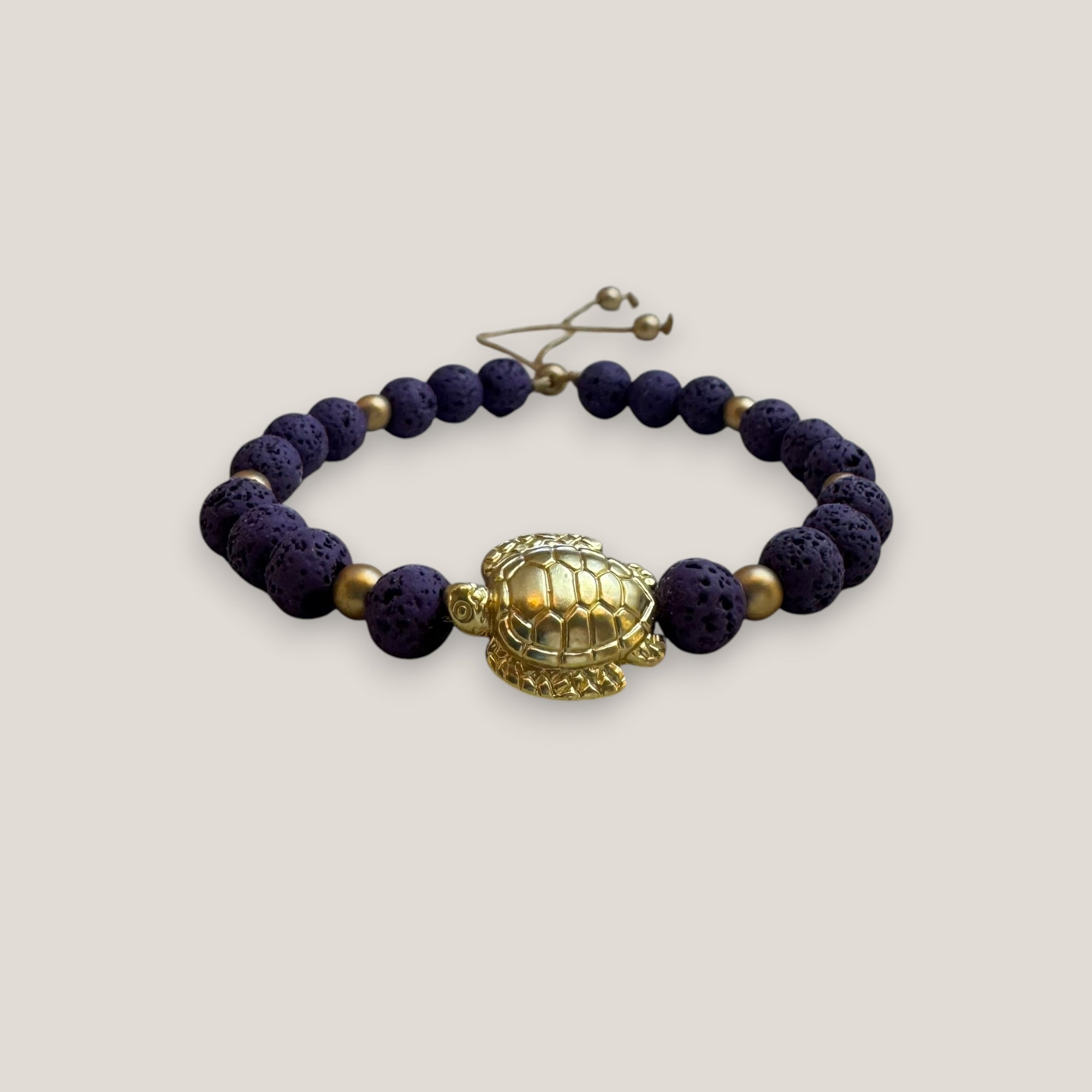 Bracelet with large golden turtle and colored lava