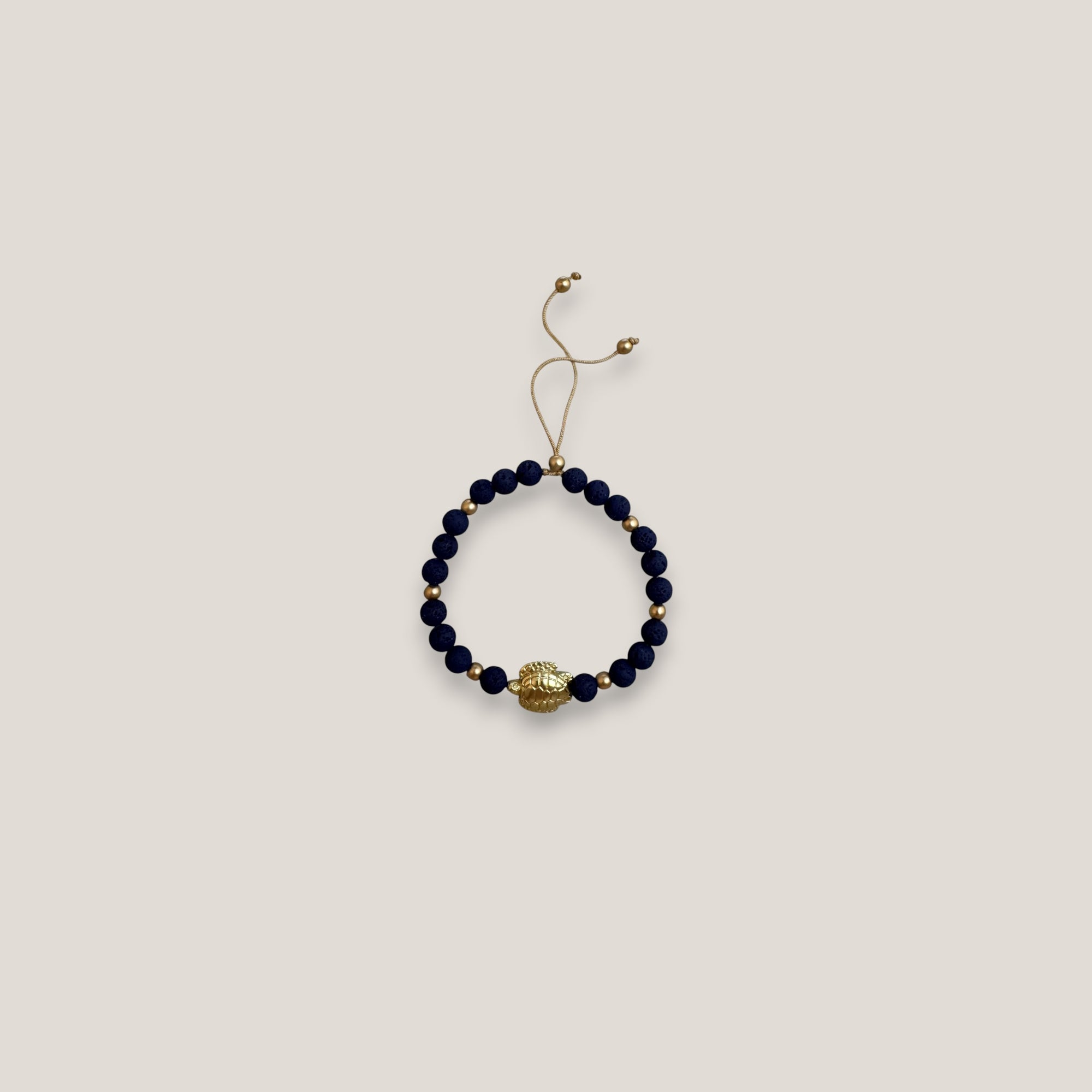 Bracelet with large golden turtle and colored lava