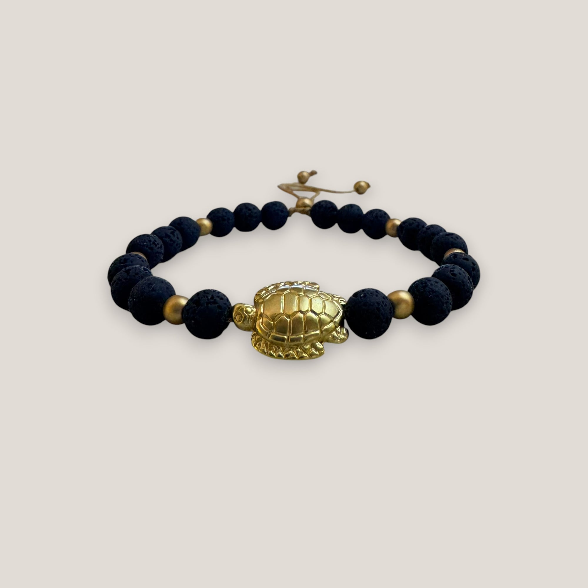 Bracelet with large golden turtle and colored lava
