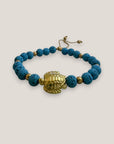 Pulsera con gran tortuga dorada lava azul azulín