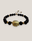 Pulsera con gran tortuga dorada lava negra
