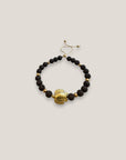 Pulsera con gran tortuga dorada lava marrón oscuro