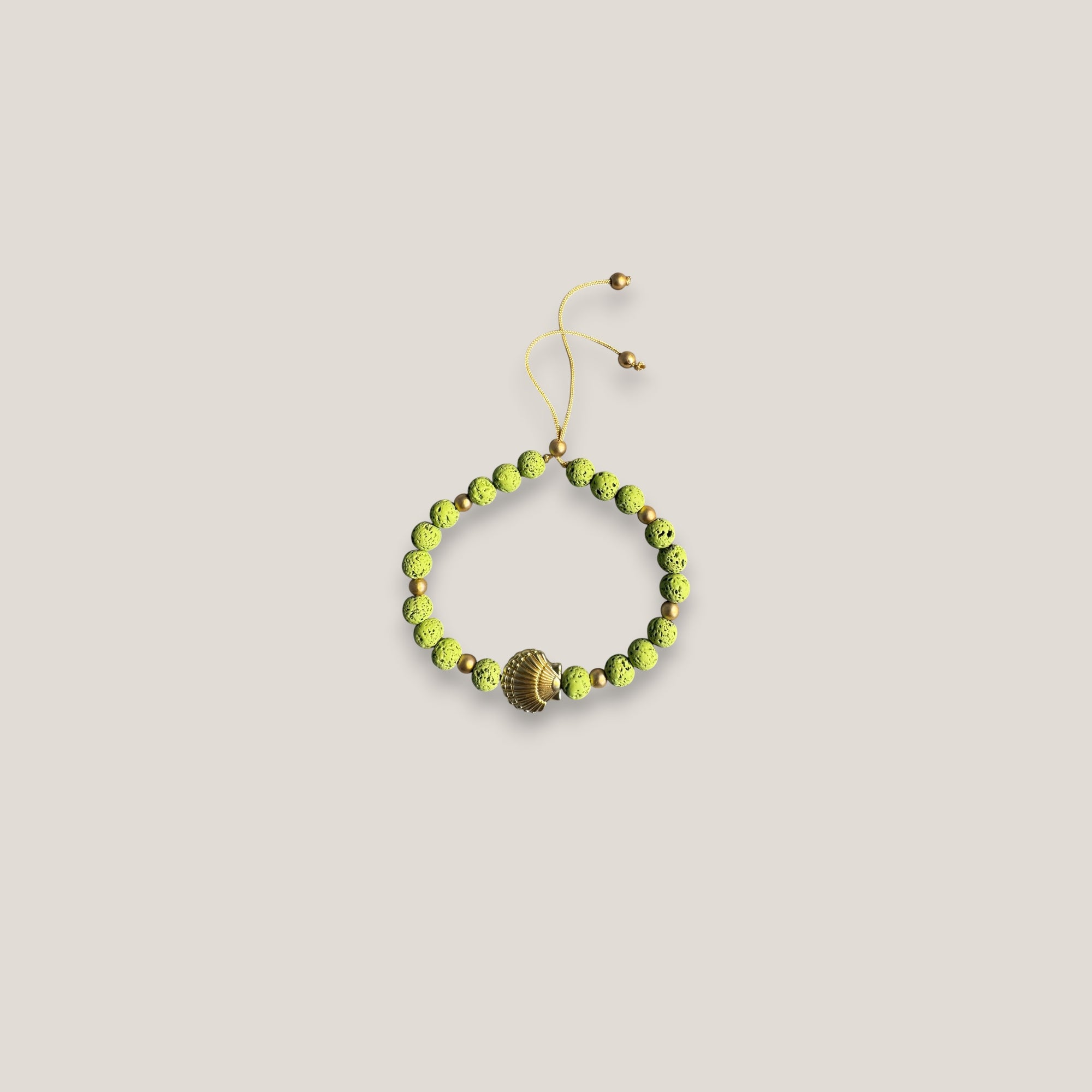 Pulsera gran concha dorada lava verde claro