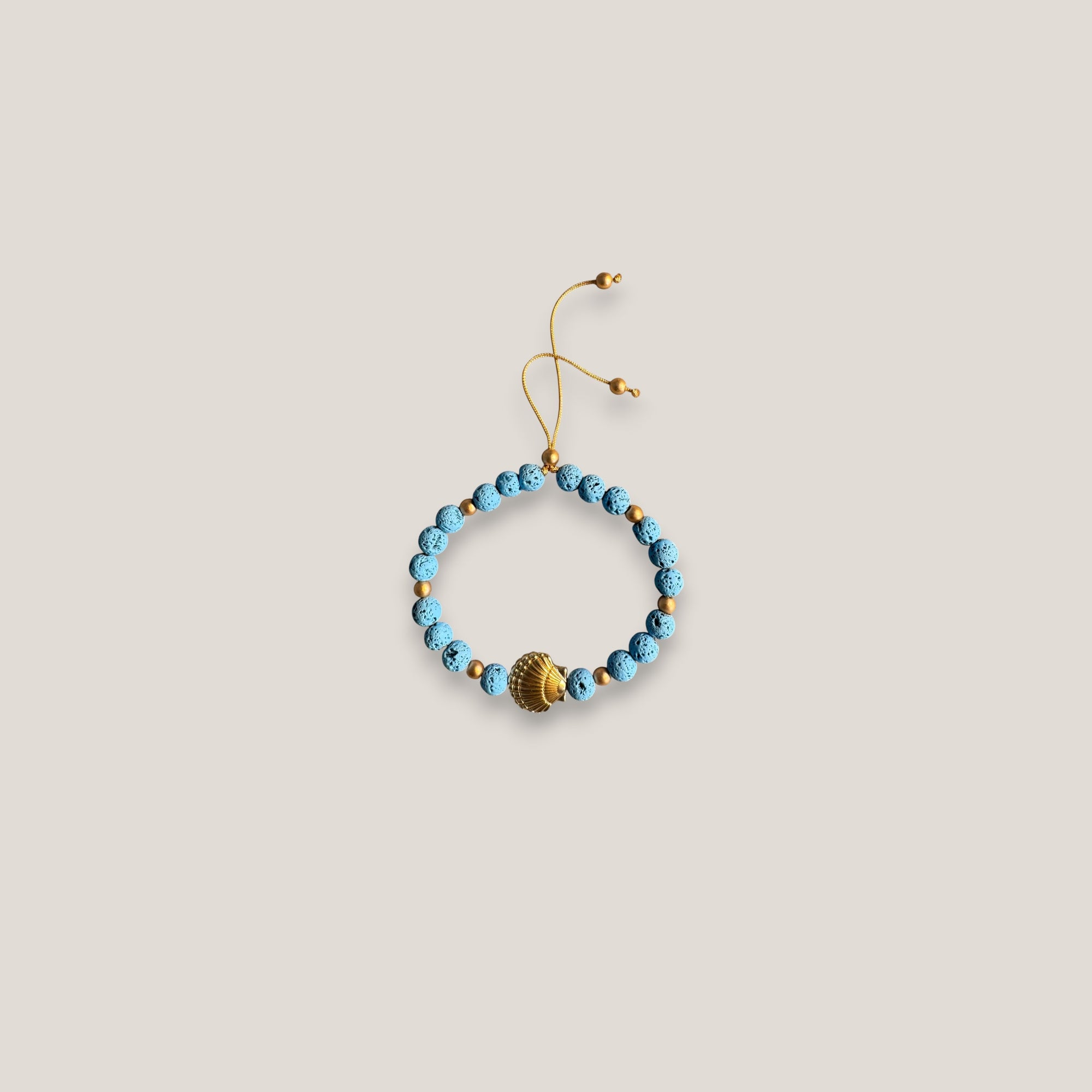 Pulsera gran concha dorada lava azul azulín
