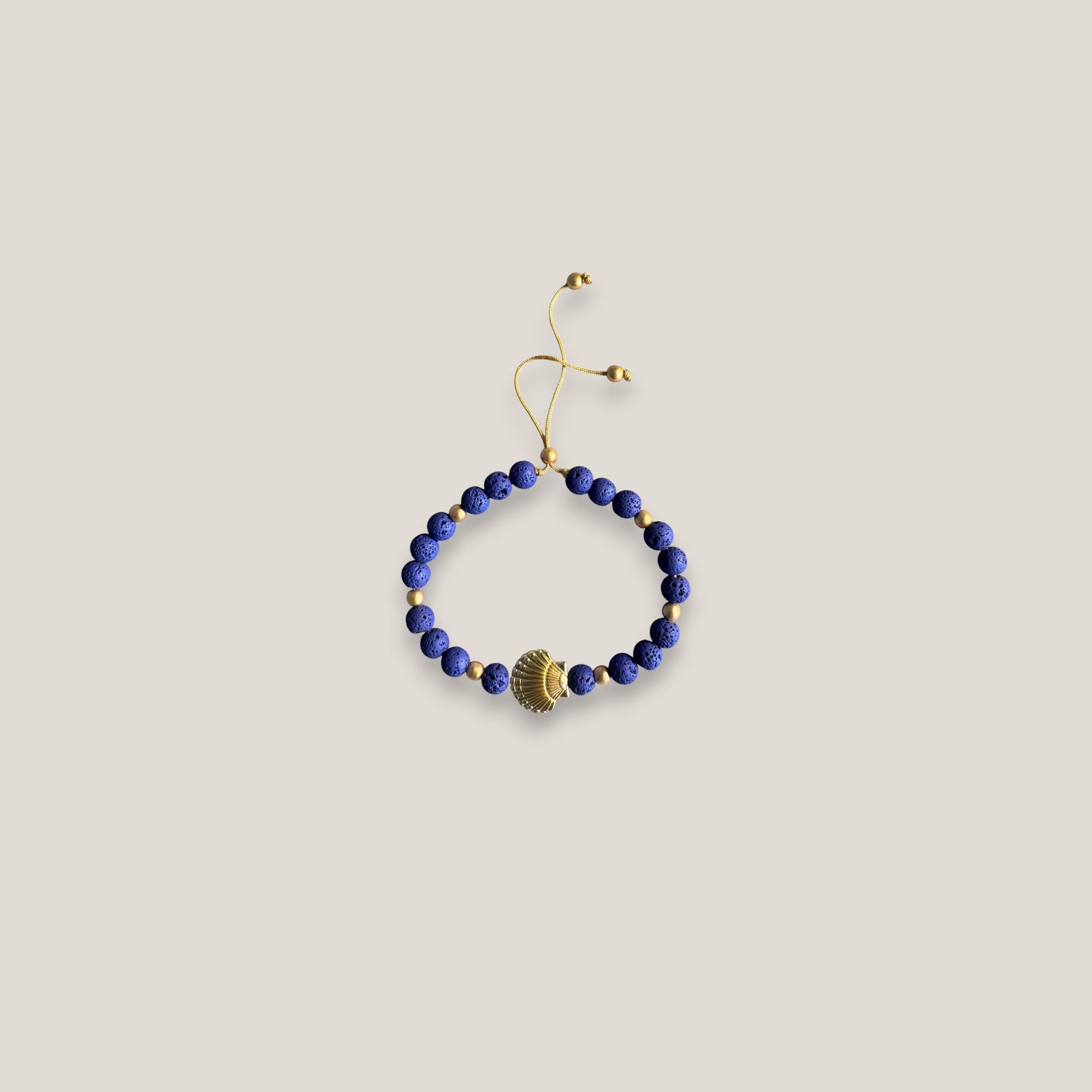 Pulsera gran concha dorada lava azul azulón